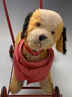 Lot 765 - Chiltern Toys Push Along Dog - A somewhat...