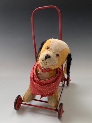 Lot 765 - Chiltern Toys Push Along Dog - A somewhat...