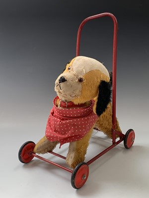 Lot 765 - Chiltern Toys Push Along Dog - A somewhat...