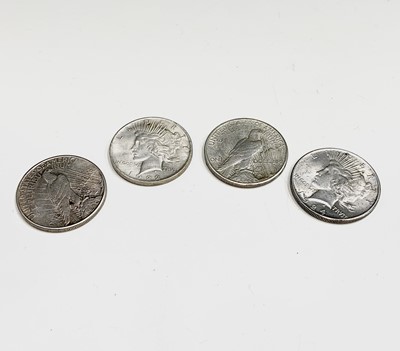 Lot 28 - USA Peace Silver Dollars - A run of four US...