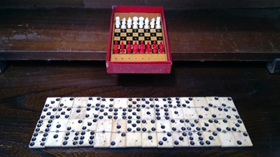 Lot 169 - Twentyeight bone and ebony dominoes, and a...