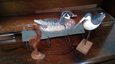 Lot 183 - Tin coat hooks modeled as a duck, wood carved...