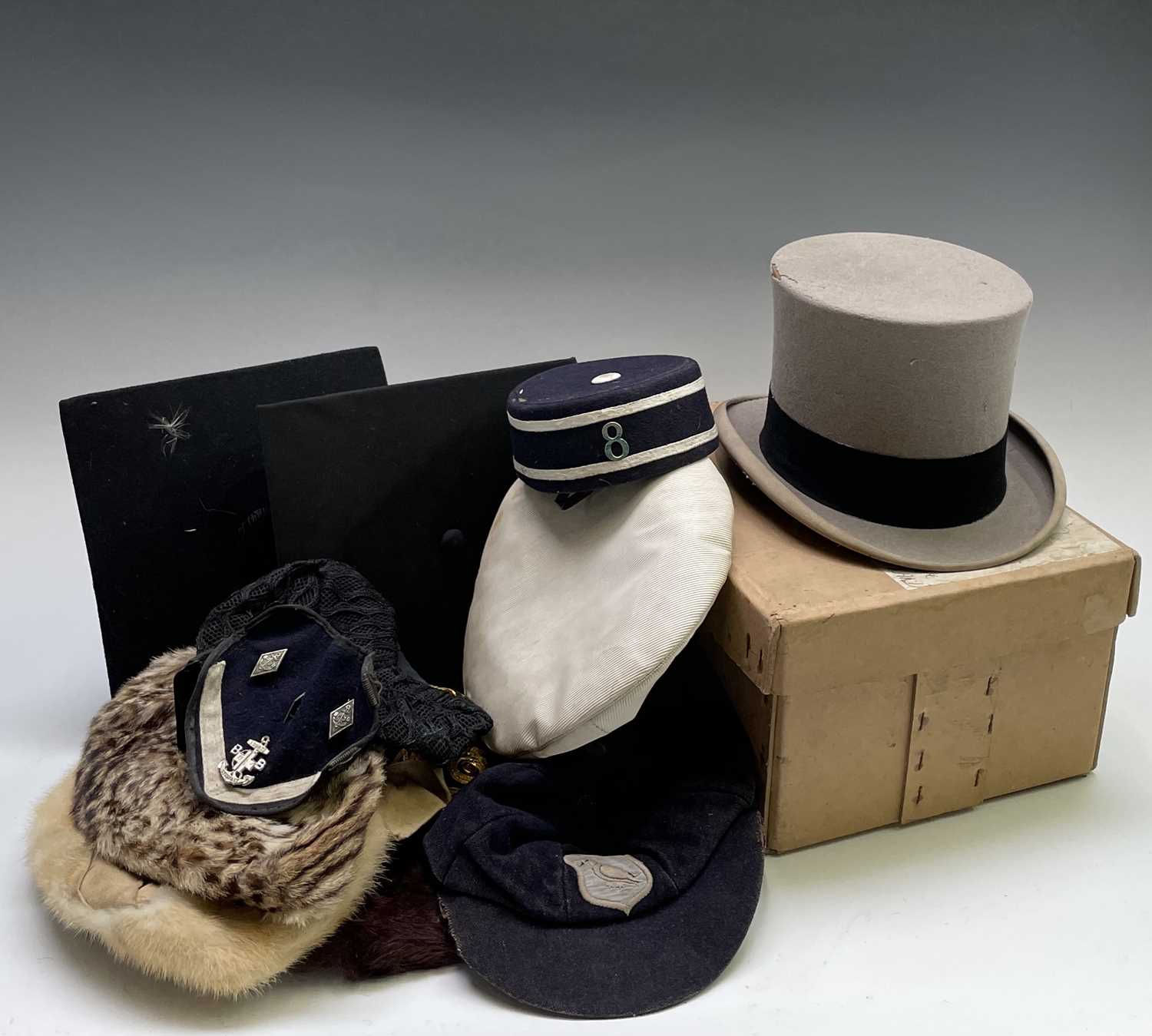 Lot 65 - A selection of hats and caps, including a top...