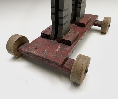 Lot 85 - A 20th century wooden elephant push-along toy,...