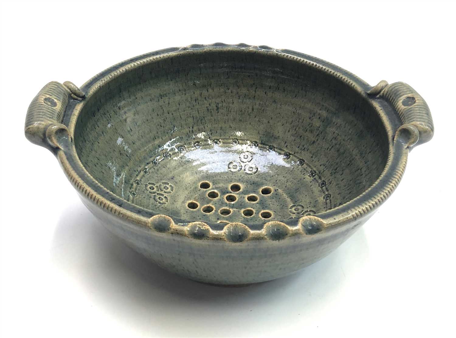 Lot 1015 - A John Vasey St Agnes studio pottery colander...