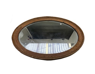 Lot 416 - A Victorian pine oval mirror with bevelled...