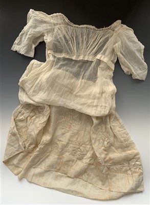 Lot 3216 - An early 19th century sheer white muslin gown...