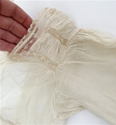 Lot 3216 - An early 19th century sheer white muslin gown...