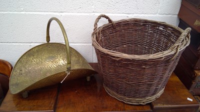 Lot 217 - Large wicker log basket and a brass log basket.