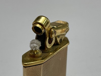 Lot 44 - A 9ct gold Karl Weiden cigarette lighter,...