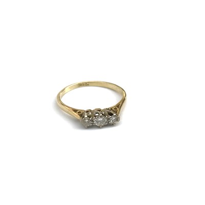 Lot 2628 - A gold ring set three diamonds.