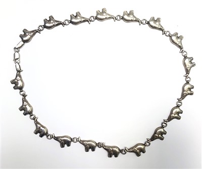 Lot 2630 - A silver procession of elephants necklace.