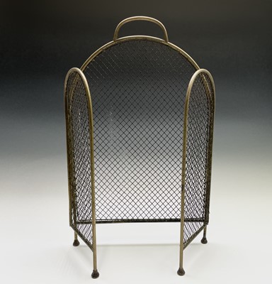 Lot 189 - A Victorian brass and wire mesh folding fire...