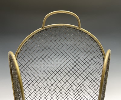 Lot 189 - A Victorian brass and wire mesh folding fire...