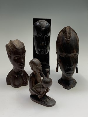 Lot 39 - Four African carved wood figures. Tallest 23cm.