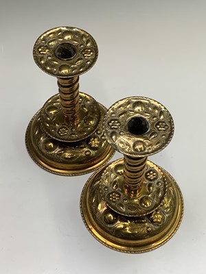 Lot 11 - A pair of brass candlesticks, circa 1900,...