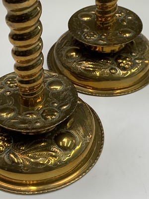 Lot 11 - A pair of brass candlesticks, circa 1900,...