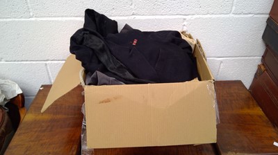 Lot 263 - A box containing navy uniforms.