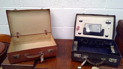 Lot 265 - A vintage leather travel case with a vintage...