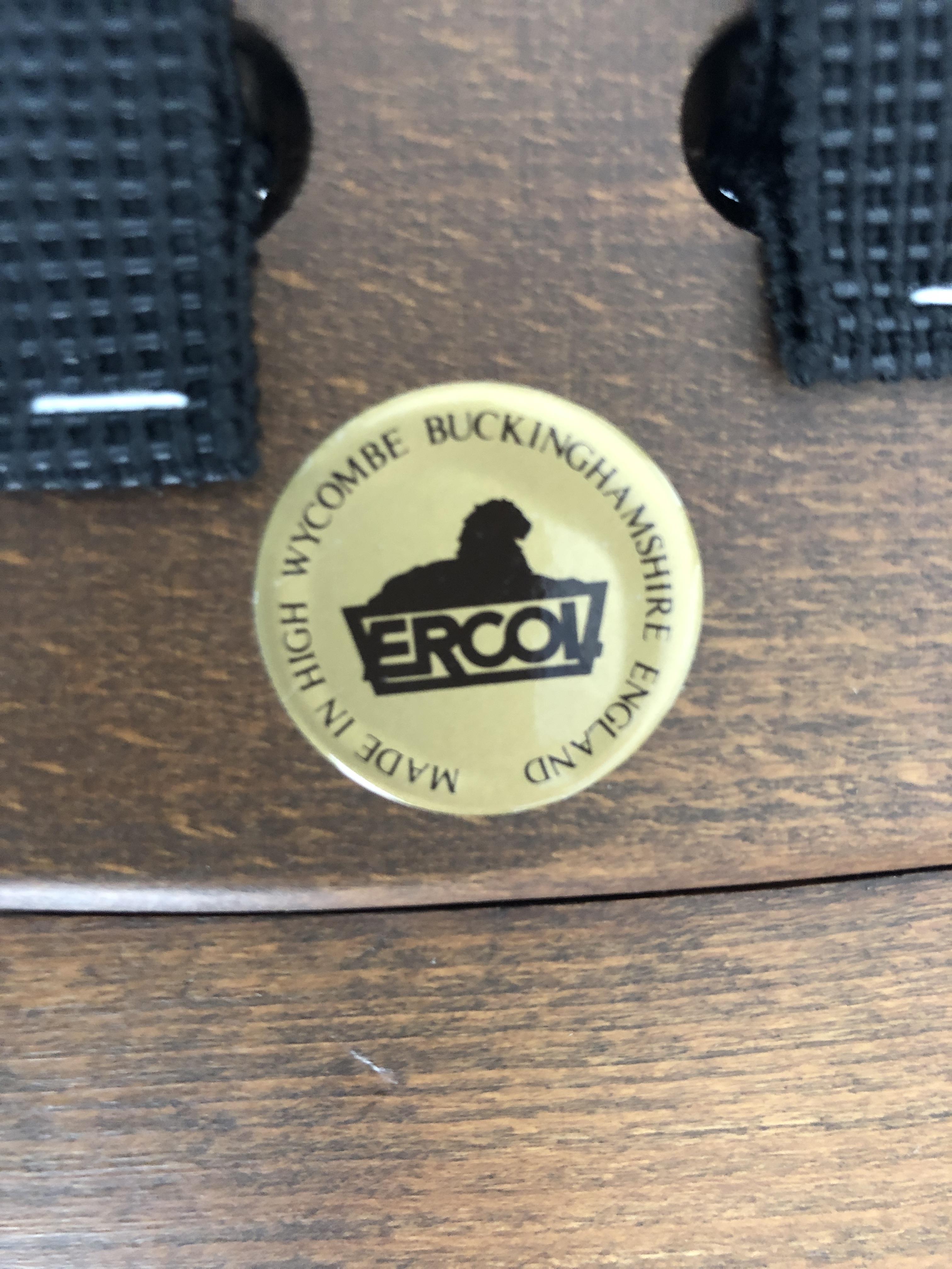 Lot 293 Ercol armchair, with makers badge.