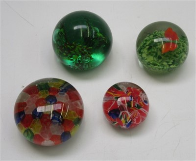 Lot 944 - Four glass paperweights and a pair of coloured...