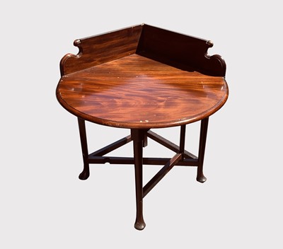 Lot 3015 - A mahogany Corner table, in early George III...