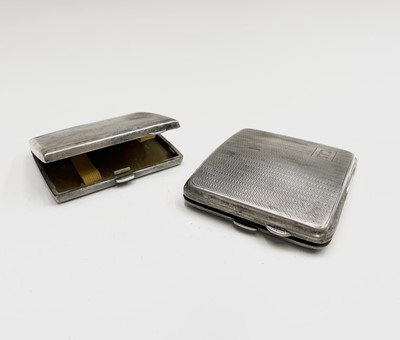 Lot 399 - Two engine-turned silver cigarette cases, 7.1oz.