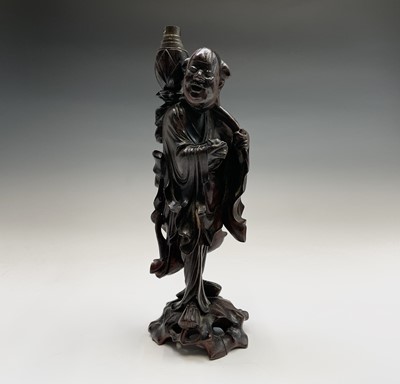 Lot 309 - A Chinese carved hardwood figural table lamp....