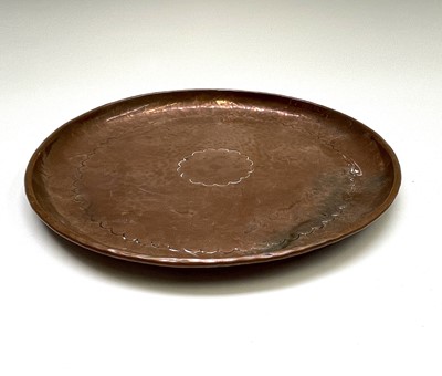 Lot 107 - A Newlyn copper shallow dish with a planished...