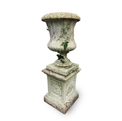 Lot 600 - A reconstituted stone garden urn of campana...