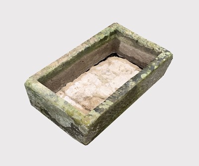 Lot 604 - A carved stone trough planter of rectangular...