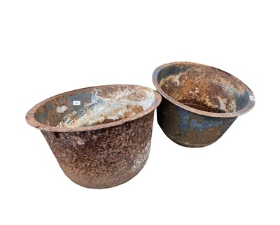 Lot 601 - A near pair of cast iron cauldrons. Both...