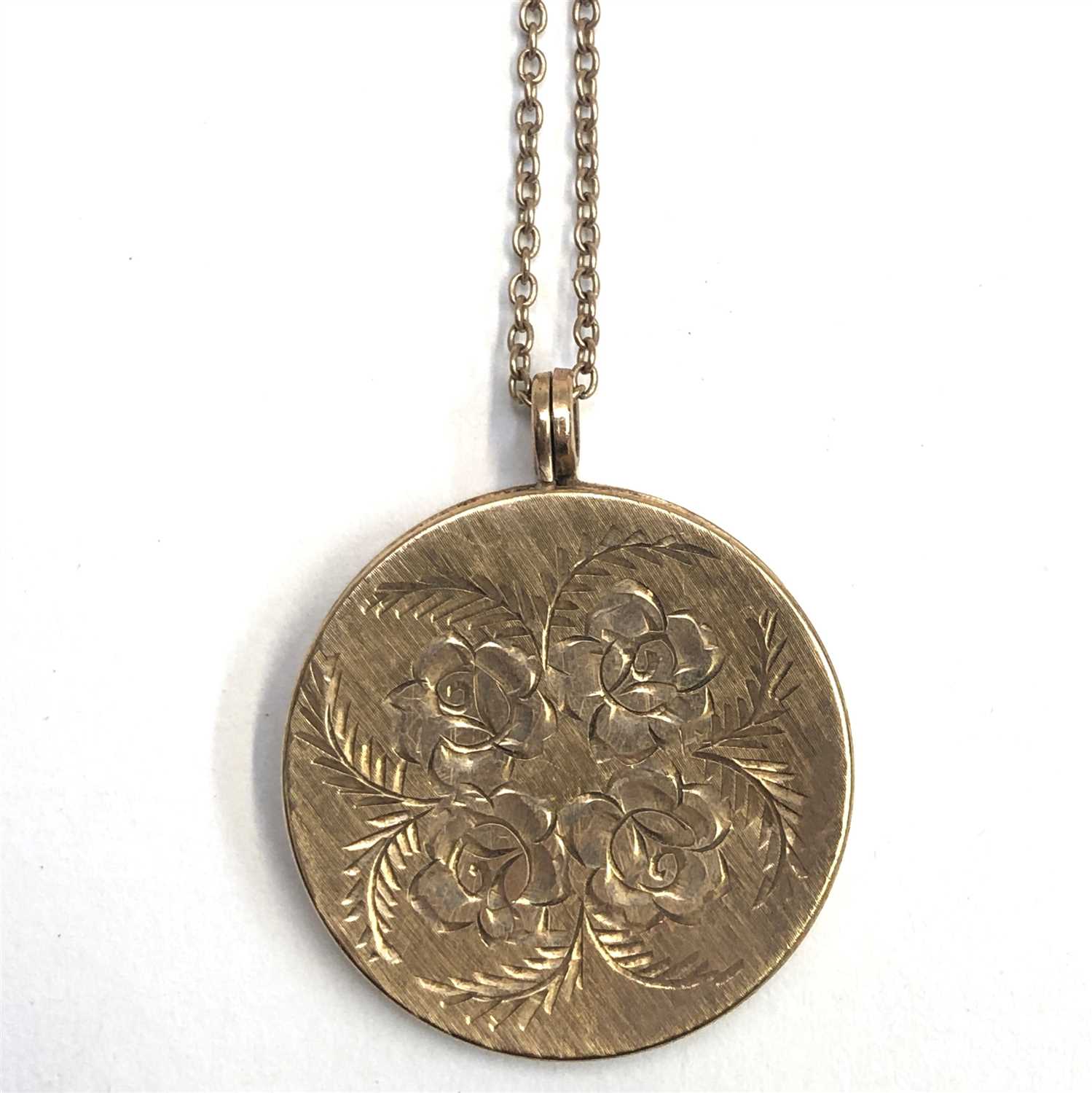 Lot 2455 - A 9ct gold, post War rose engraved locket