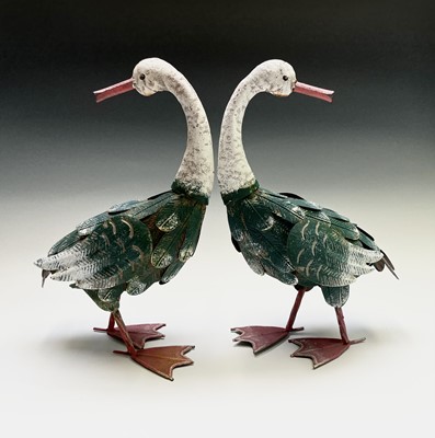 Lot 159 - A pair of painted metal geese ornaments....