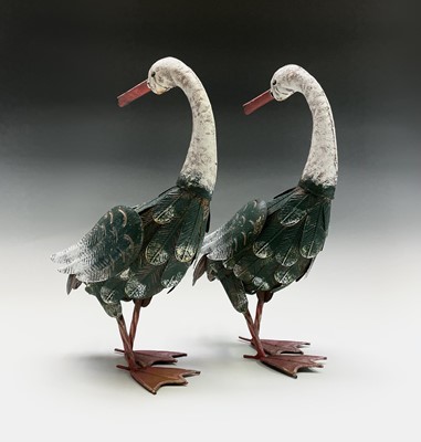 Lot 159 - A pair of painted metal geese ornaments....