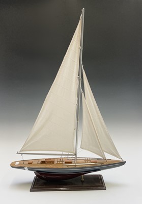 Lot 312 - A model racing yacht, with blue and maroon...