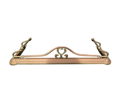Lot 38 - A brass Art Nouveau design fender, with open...