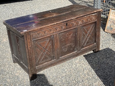 Lot 42 - A carved oak coffer, 17th century, with arch...