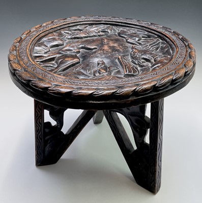 Lot 256 - An African circular hardwood occasional table,...