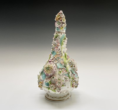 Lot 899 - A 19th century floral encrusted vase and cover,...