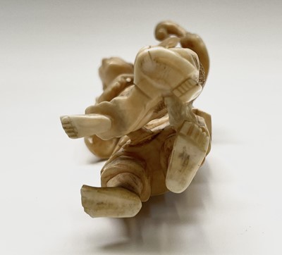 Lot 42 - A Japanese carved ivory okimono, Meiji period,...