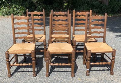 Lot 135 - A set of six ladderback rush seated dining...