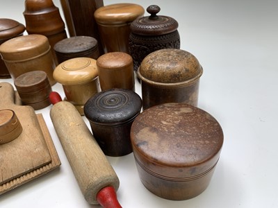 Lot 149 - A collection of treen jars and containers, and...