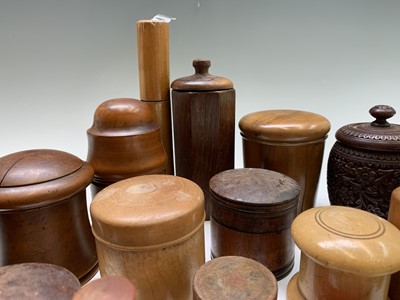 Lot 149 - A collection of treen jars and containers, and...