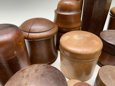 Lot 149 - A collection of treen jars and containers, and...