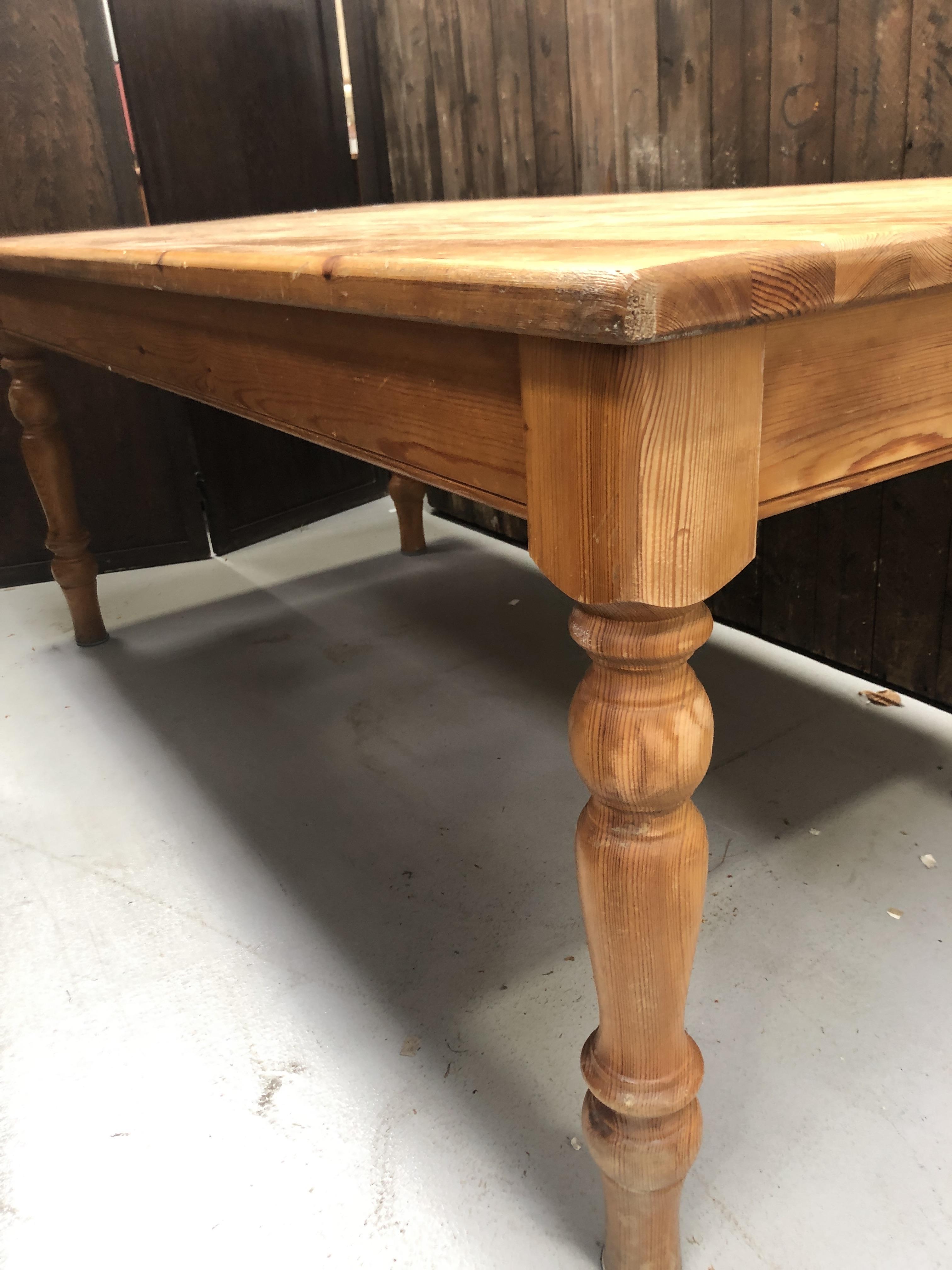 Lot 186 - A large rectangular pine kitchen table, 20th