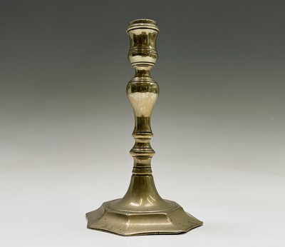 Lot 110 - An 18th century brass candlestick, with...