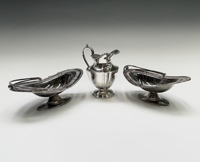 Lot 165 - An Arts and Crafts style silver plated twin...