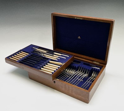 Lot 185 - An oak cased canteen of silver plated cutlery,...