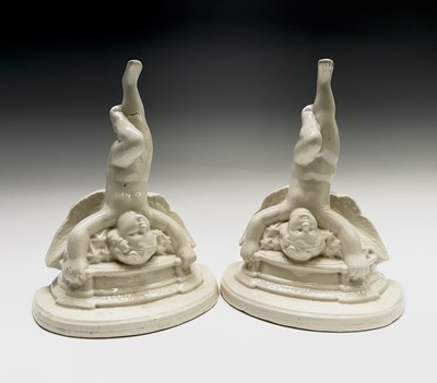 Lot 918 - A pair of pottery cherub wall brackets, 20th...